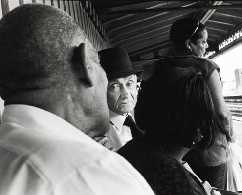 Passengers waiting and having conversion at 36th Ave NYC subway stop platform Astoria Queens