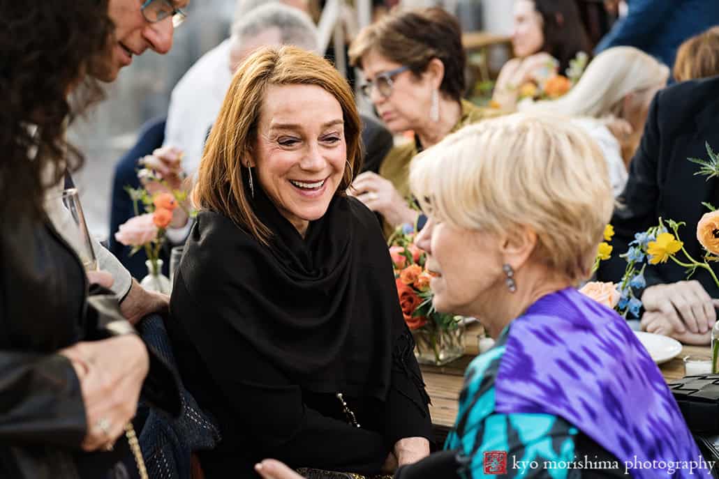 Roberta's Pizza, Brooklyn, Bushwick, NYC restaurant backyard wedding reception Kyo guests having fun smiling at table