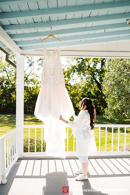 Bride checking her dress outdoor getting ready Princeton NJ Updike Farmstead summer fall autumn Wedding