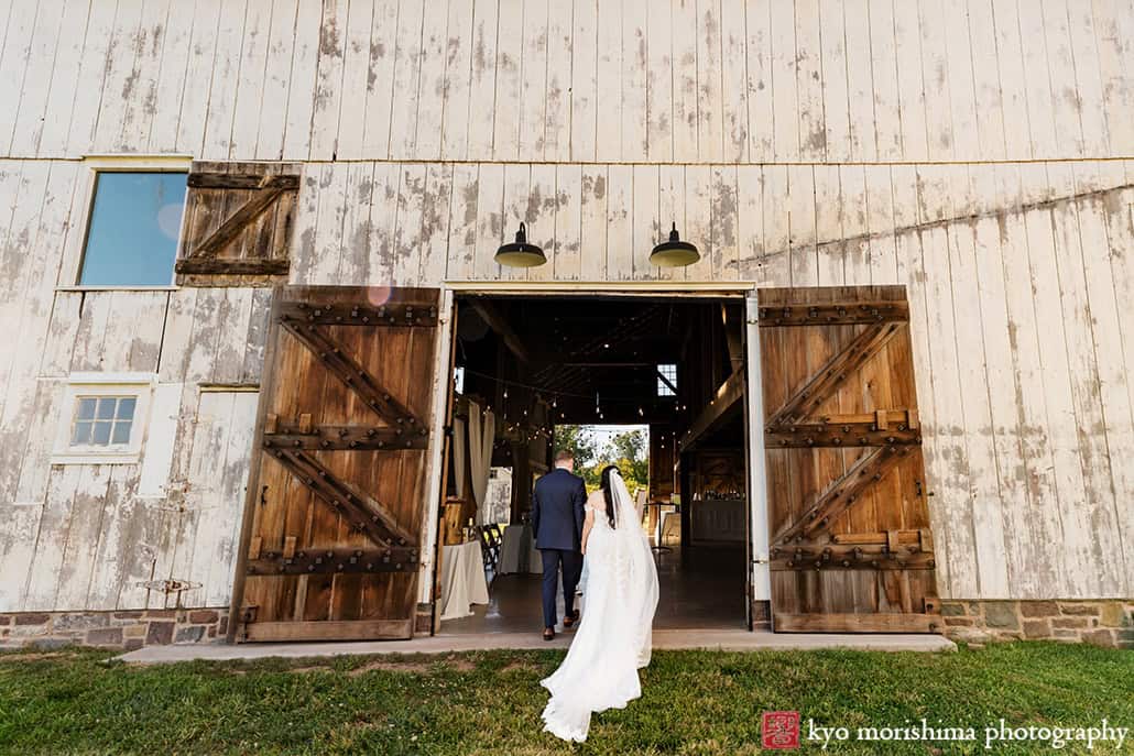 outdoor ceremony barn, field, Princeton NJ Updike Farmstead summer fall autumn Wedding groom walking in