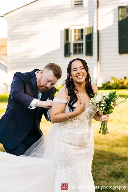 outdoor portrait bride and groom helping dress newlyweds holding hands tree field, Princeton NJ Updike Farmstead summer fall autumn Wedding