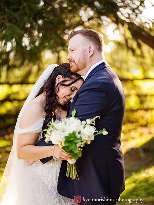 outdoor portrait bride and groom newlyweds hug tree field, Princeton NJ Updike Farmstead summer fall autumn Wedding