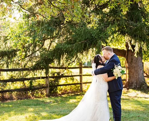 outdoor portrait bride and groom newlyweds kiss tree field, Princeton NJ Updike Farmstead summer fall autumn Wedding