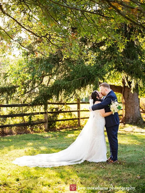 outdoor portrait bride and groom newlyweds kiss tree field, Princeton NJ Updike Farmstead summer fall autumn Wedding
