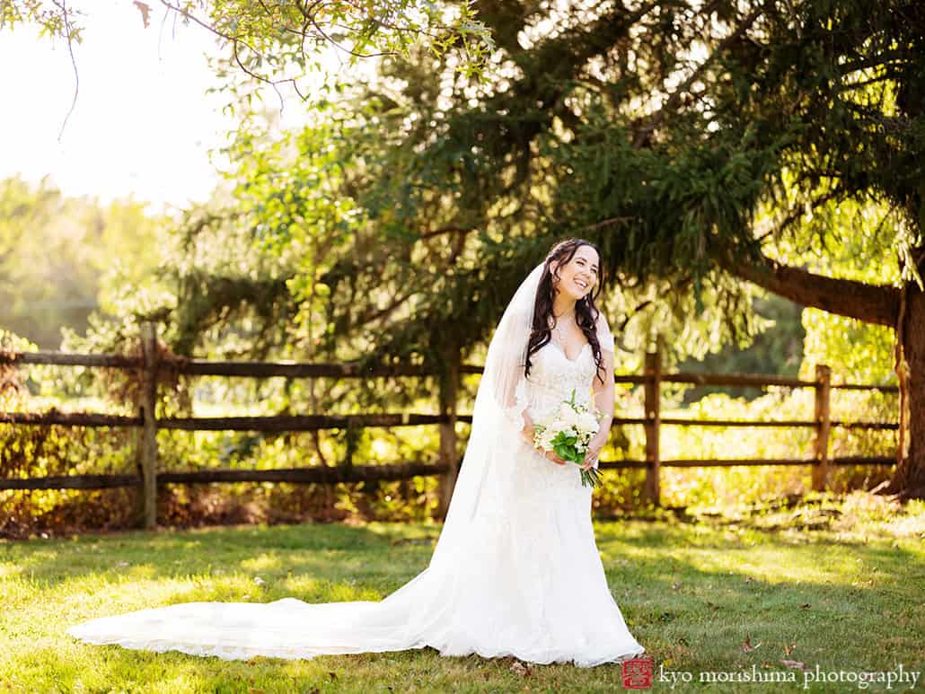 outdoor portrait bride laughing newlyweds holding hands tree field, Princeton NJ Updike Farmstead summer fall autumn Wedding