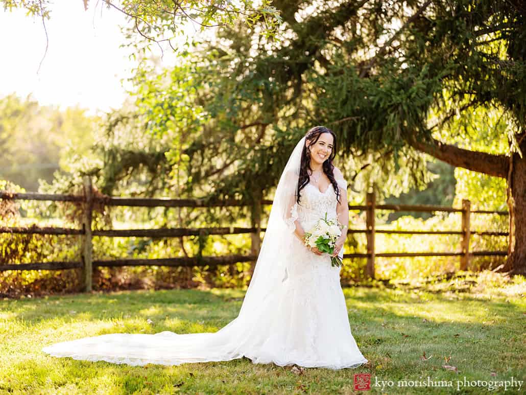 outdoor portrait bride newlywed smiling holding hands tree field, Princeton NJ Updike Farmstead summer fall autumn Wedding