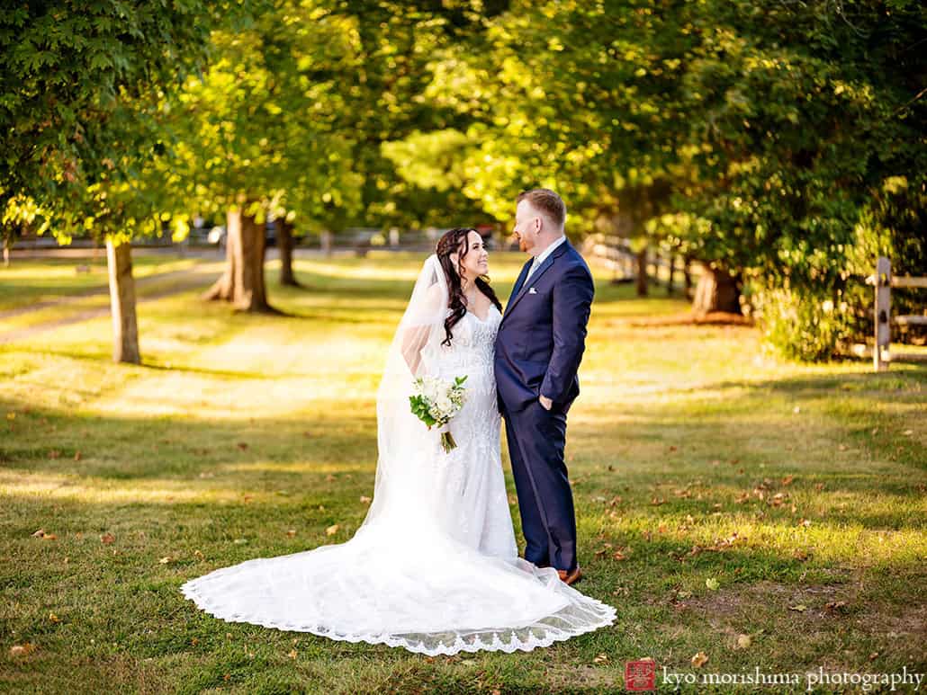 outdoor portrait bride and groom newlyweds holding hands tree field, Princeton NJ Updike Farmstead summer fall autumn Wedding