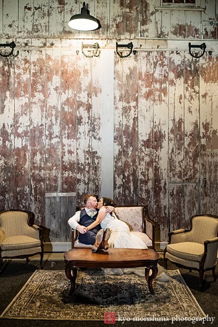 outdoor night portrait bride and groom newlyweds laughing relaxing on a couch kissPrinceton NJ Updike Farmstead summer fall autumn Wedding