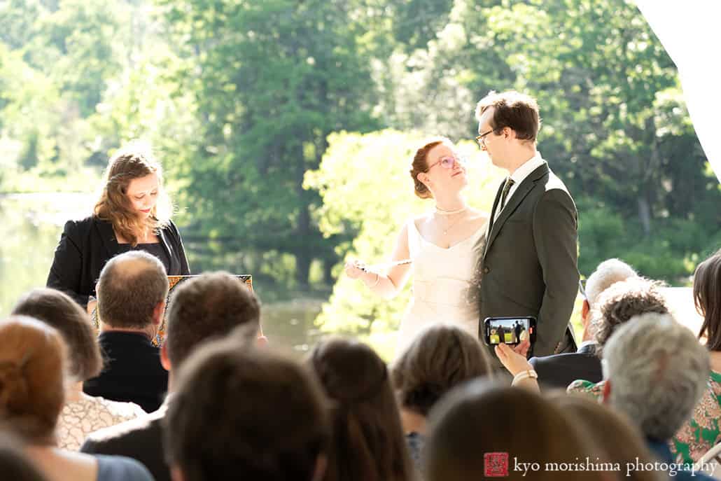 Spring Mountain Lakes House Princeton NJ outdoor wedding sunny ceremony looking at each other smiling