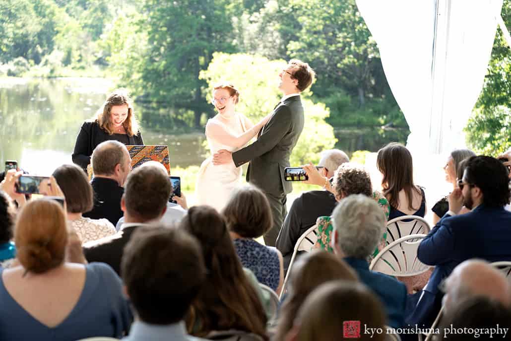 Spring Mountain Lakes House Princeton NJ outdoor wedding sunny ceremony holding laughing