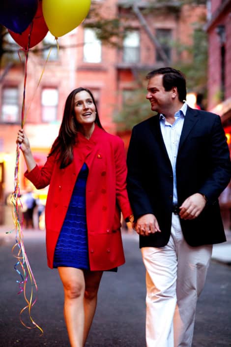 Couple Walking Down the Street Holding Their Hands Smiling on a Dating with Colorful Balloons Greenwich Village NYC