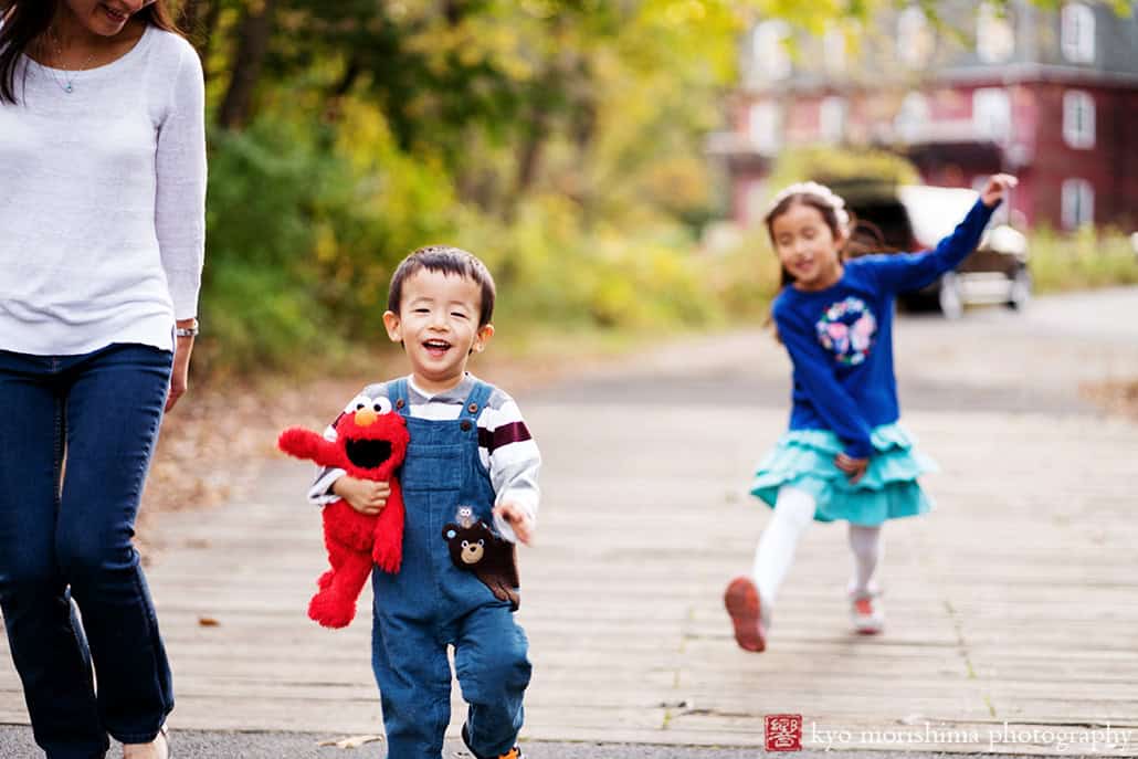 Children and parents walking smiling outside d&r park Kingston New Jersey fall family photo