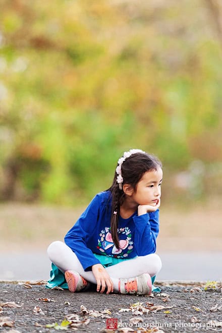 a girl sitting on the ground thinking outside d&r park Kingston New Jersey fall Princeton family photo