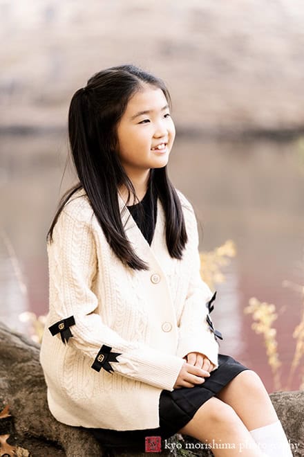 fall girl smiling and talking to her family d&r park Kingston New Jersey family photo