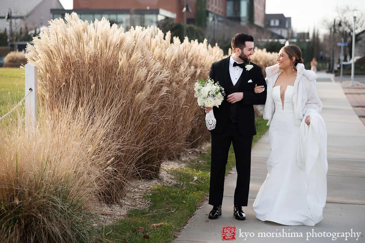Asbury Hotel, NJ, Asbury Park, winter wedding bride and groom outdoor street portrait walk smiling