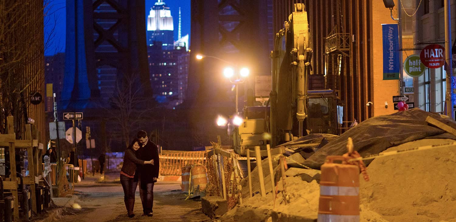 Brooklyn bridge park Dumbo new york city nyc Manhattan bridge night empire state building construction site engagement portrait