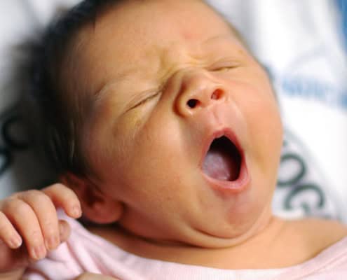 girl baby yawning newborn family portrait NYC