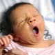 girl baby yawning newborn family portrait NYC
