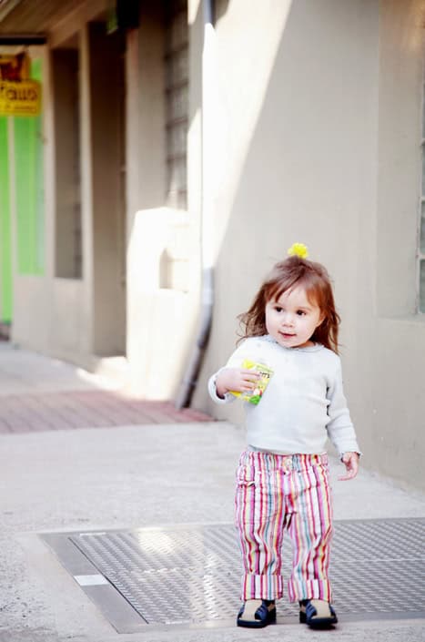girl walking down the street child family portrait NYC girl walking down the street child family portrait NYC