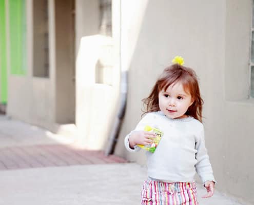 girl walking down the street child family portrait NYC