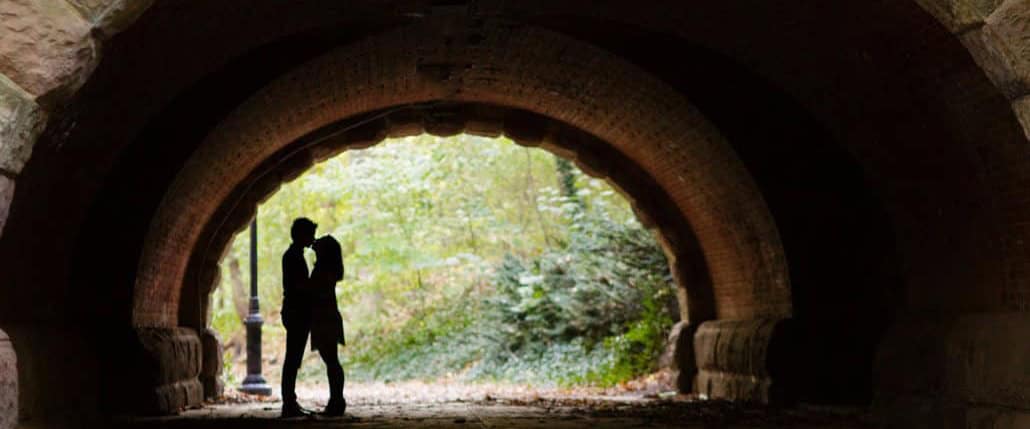 Fall Prospect Park Brooklyn NYC engagement portrait in tunnel kiss