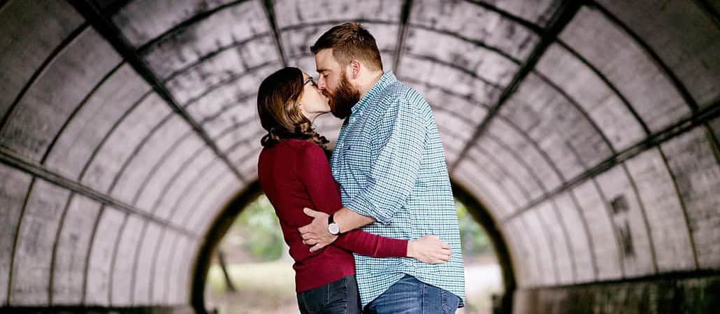 Fall Prospect Park Brooklyn NYC engagement portrait in tunnel kiss