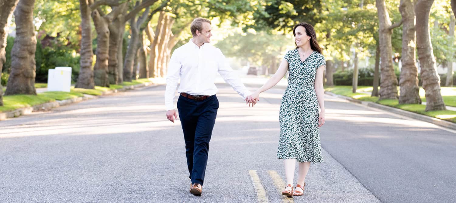 Spring Lake NJ engagement portrait of Brooklyn NYC couplebay ocean smile holding hans