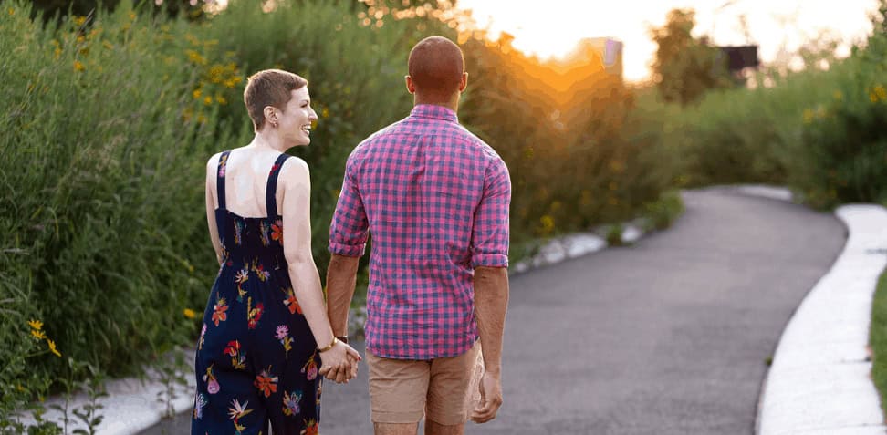 governors island engagement portrait photo cycling bike velo couple engaged nyc fun smile skyscraper city